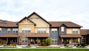 exterior image of multi-unit housing blue, tan, brown